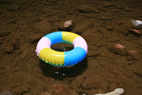 Inflatable pool toy in stream Stock Photos