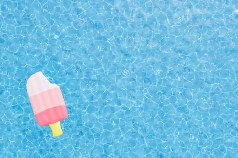 Inflatable popsicle floating in swimming pool 스톡 일러스트