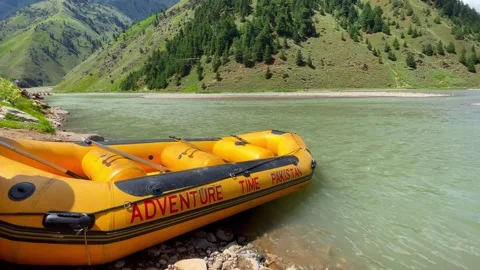Inflatable rafts ready for rafting excursion on the Kunhar River in Naran Stock Footage 304427321