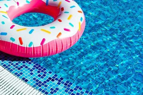 Inflatable ring with doughnut design. Concept of summer vacation fun Stock Photos