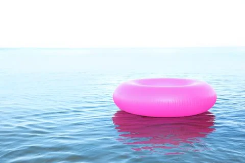 Inflatable ring floating on sea water. Summer vacation Stock Photos