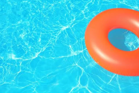 Inflatable ring floating in swimming pool on sunny day. Space for text Stock-Fotos