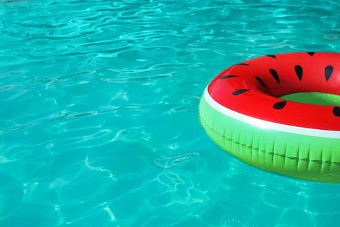 Inflatable ring floating in swimming pool on sunny day. Space for text Stock-Fotos