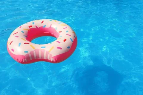 Inflatable ring floating in swimming pool on sunny day. Space for text Stock-Fotos