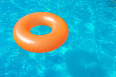 Inflatable ring floating in swimming pool on sunny day. Space for text Stock-Fotos
