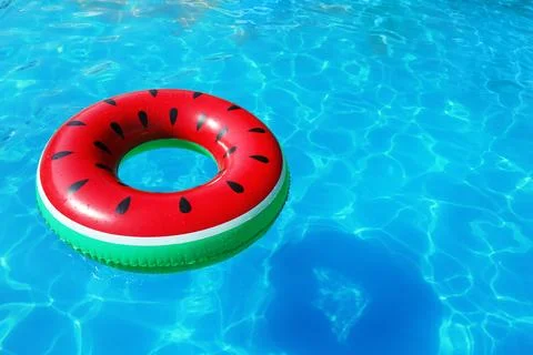Inflatable ring floating in swimming pool on sunny day. Space for text Stock-Fotos