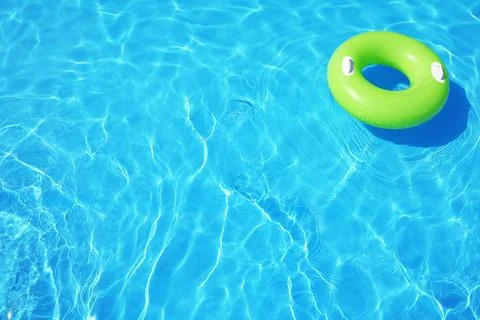 Inflatable ring floating in swimming pool on sunny day. Space for text Stock-Fotos