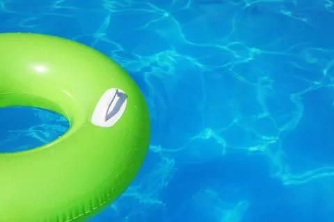 Inflatable ring floating in swimming pool on sunny day. Space for text Stock-Fotos