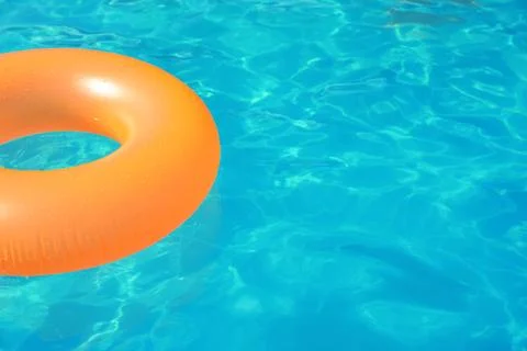Inflatable ring floating in swimming pool on sunny day. Space for text Stock-Fotos