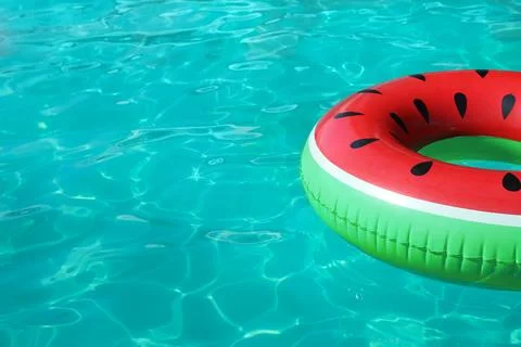 Inflatable ring floating in swimming pool on sunny day. Space for text Stock-Fotos