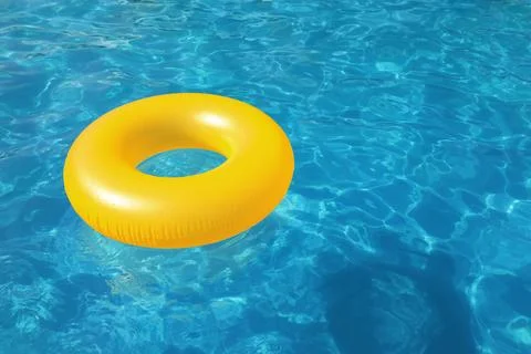 Inflatable ring floating in swimming pool on sunny day. Space for text Stock-Fotos