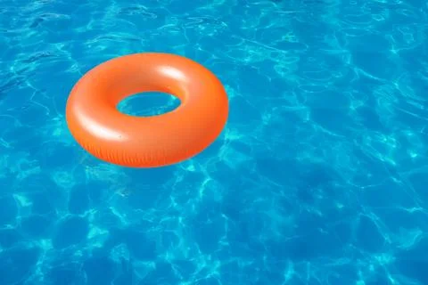 Inflatable ring floating in swimming pool on sunny day. Space for text Stock-Fotos
