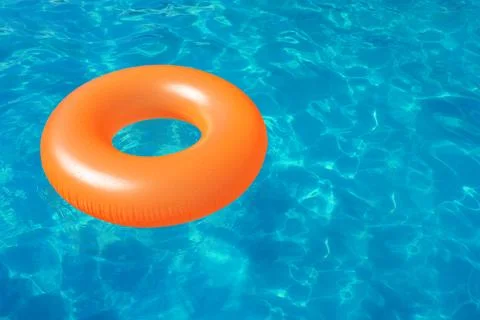 Inflatable ring floating in swimming pool on sunny day. Space for text Stock-Fotos