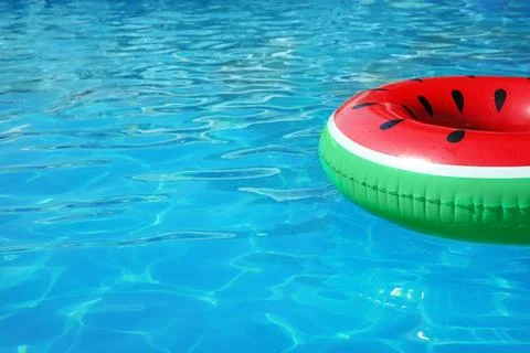 Inflatable ring floating in swimming pool on sunny day. Space for text Stock-Fotos