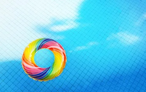Inflatable ring in the pool water. Vacation background Stock Photos