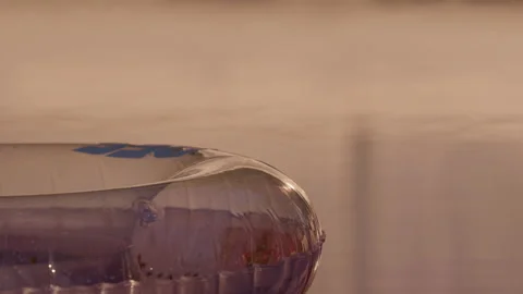 Inflatable swim ring floating in pool under warm sunset light Stock-Footage 342768675