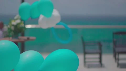Inflatable turquoise and white balloons in the wind Stock Footage 147686047