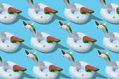 Inflatable unicorn pool toy pattern on blue background. Minimal summer concep 스톡 사진