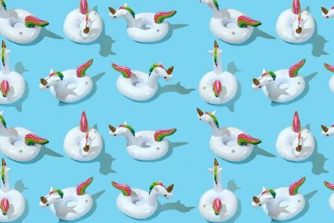 Inflatable unicorn pool toy pattern on blue background. Minimal summer concep 스톡 사진