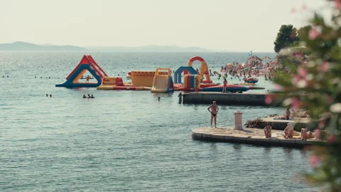 Inflatable Water Park at Adriatic Beach Stockbeeldmateriaal 340070121