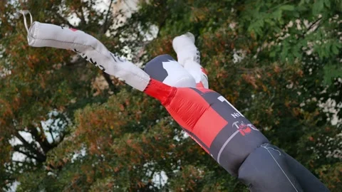 Inflatable worker figure with store adve... | Stock Video | Pond5