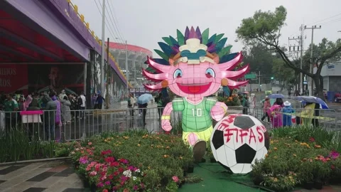 An inflatable World Cup mascot outside Estadio Azteca Stock Footage 345278471