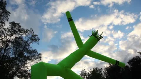Inflated man dance at background of sky with clouds on City Day Stock Footage 8920929