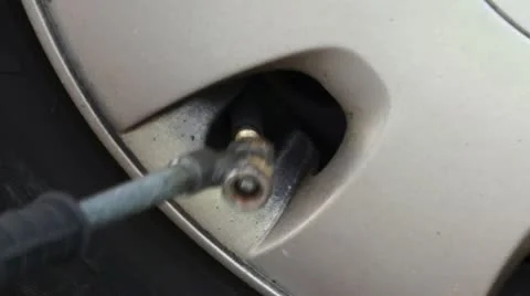 Inflating a car tyre Stock Footage 10998315