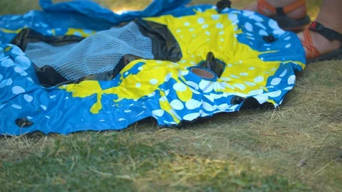 Inflating an Inner Tube in the Grass Stock Footage 92632010