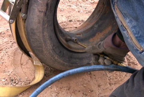 Inflating an Old Tire Stock Footage 74962