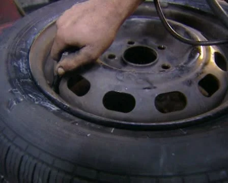 Inflating a tire Stock Footage 20510695