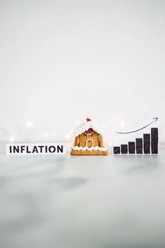 Inflation graph with stats going up next to gingerbread house, cost of livi.. Stock Photos