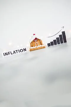 Inflation graph with stats going up next to gingerbread house, cost of livi.. Stock Photos