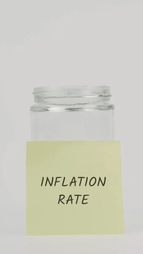 Inflation rate text or word on yellow sticky note attached to glass jar Stock Footage 311743710
