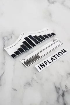 Inflation rates going down, text with graph showing stats decreasing and pr.. Stock Photos