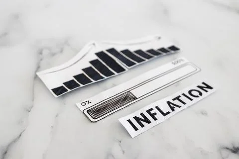 Inflation rates going down, text with graph showing stats decreasing and pr.. Stock Photos