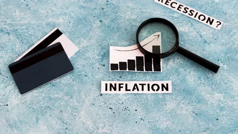Inflation text and graph showing prices going up next to recession text with  Stock Footage 217366631