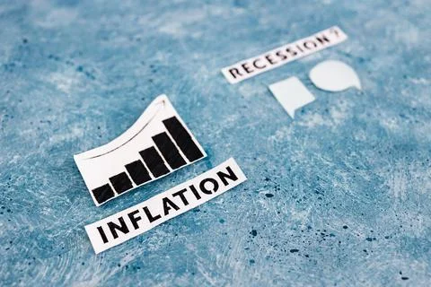 Inflation text and graph showing prices going up next to recession text with  Stock Photos