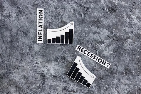 Inflation text next to graphs with stats going up  and recession text next to Stock Photos