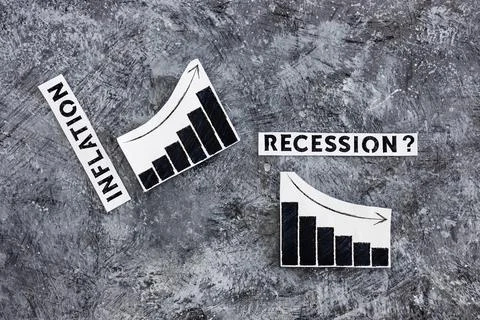 Inflation text next to graphs with stats going up  and recession text next to Stock Photos