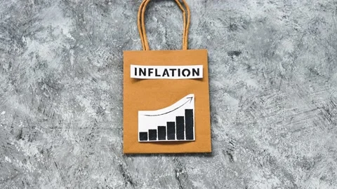 Inflation text over shopping bag with graphs showing prices going up Stock Footage 196204083