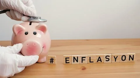 Inflation word in Turkish language. Checking the state of savings during inflati Stock Photos