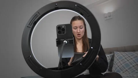 Influencer creating content with a ring light and smartphone Stock-Footage 308313028