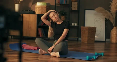 Influencer does live for social network with trainings, meditation, yoga at home Stock Footage 218832580