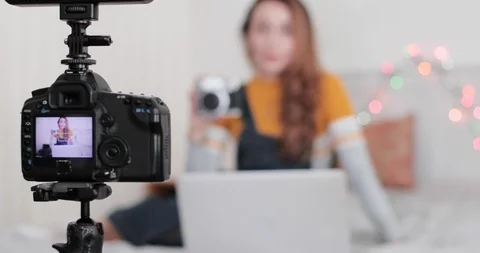 Influencer recording tutorial video at home in bedroom 動画素材 120464708