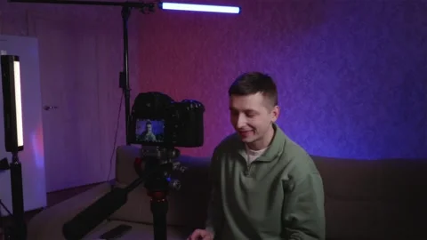 Influencer speaking to camera in a professional home studio Stock Footage 333757045