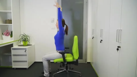 Influencer talk to a camera and show stretching moves to her viewers Stock Footage 152179225