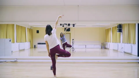  Influencer talk to a camera and show dancing moves to her viewers. Stock Footage 152181570