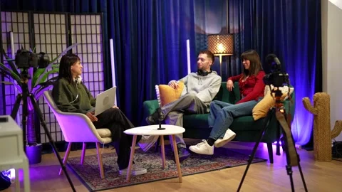 Influencers creating content during a live podcast interview Stock Footage 328633621