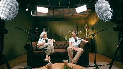 Influencers hosting a podcast interview show in a broadcasting studio Stock Footage 341483450